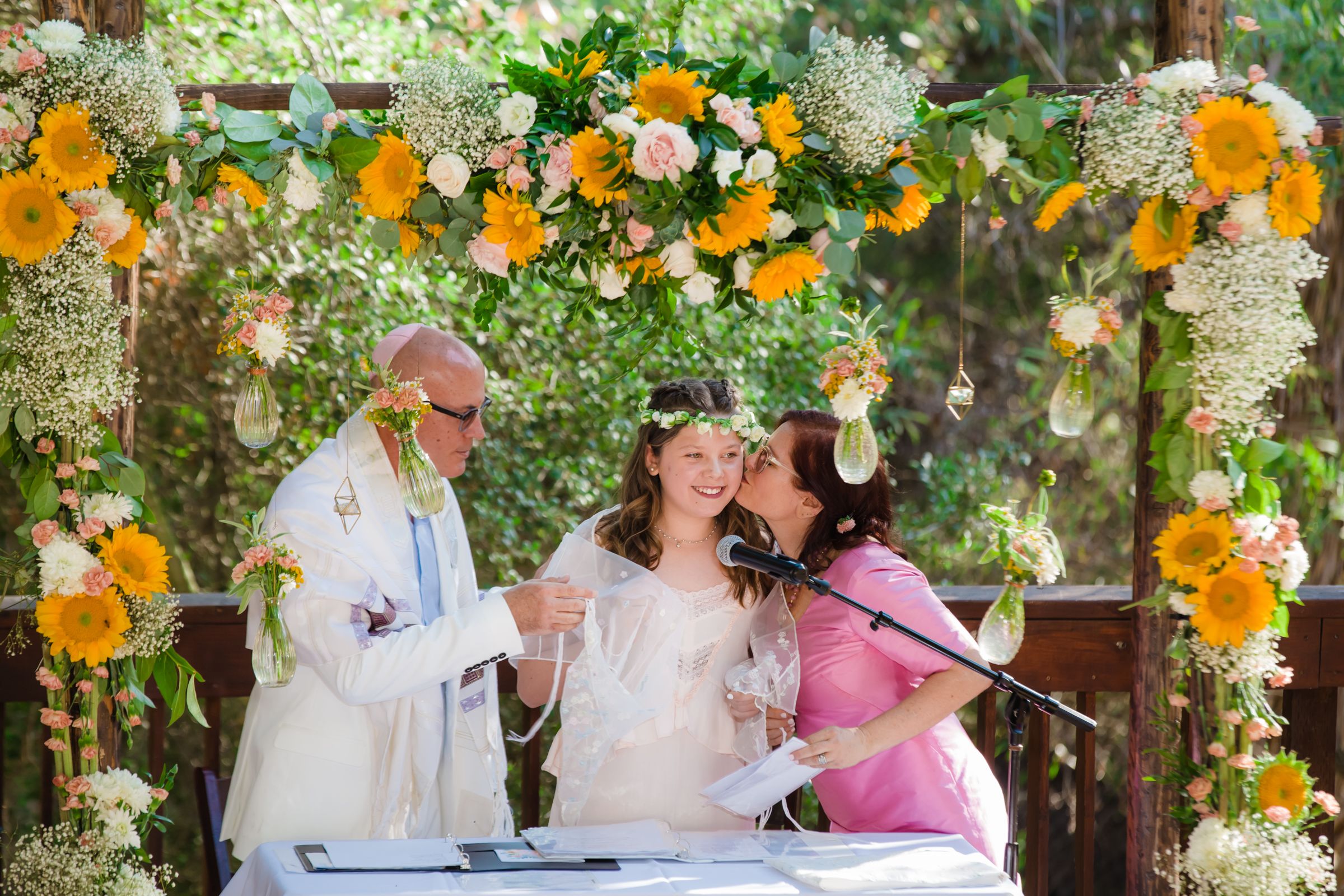 A joyful celebration of faith and family! A Bat Mitzvah girl, her mother, and the Rabbi share a heartfelt moment after reading the Torah, marking a beautiful milestone of tradition, love, and spirituality. #BatMitzvah #MitzvahPhotography #JewishTradition #TorahReading #FaithAndFamily #TimelessMoments