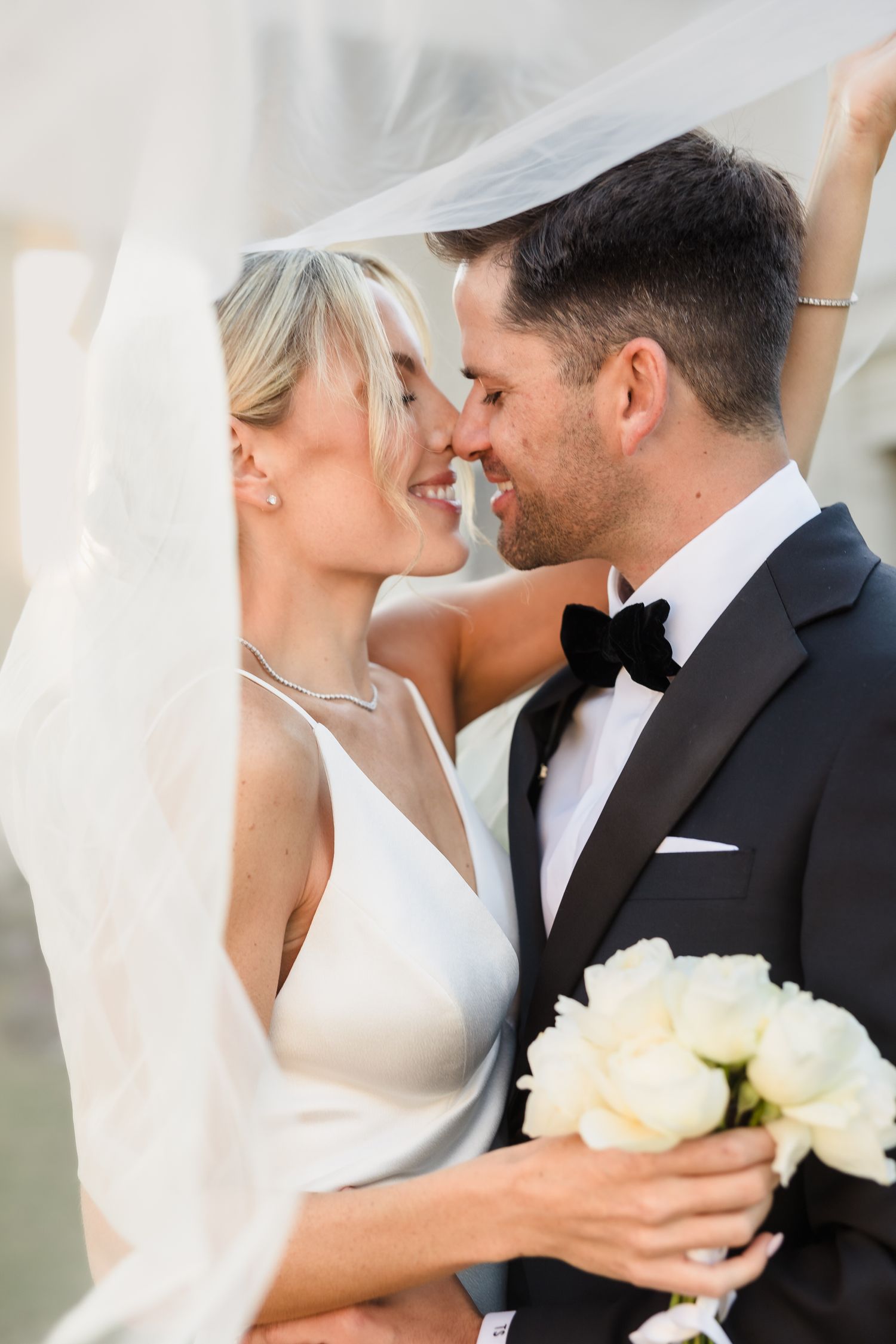 Under the veil, wrapped in love! This elegant bride and groom share a joyful moment, their smiles radiating pure happiness and romance. A timeless wedding portrait capturing love, intimacy, and forever. 💍✨ #UnderTheVeil #BrideAndGroom #TimelessLove #ElegantWedding #WeddingPhotography #HappilyEverAfter