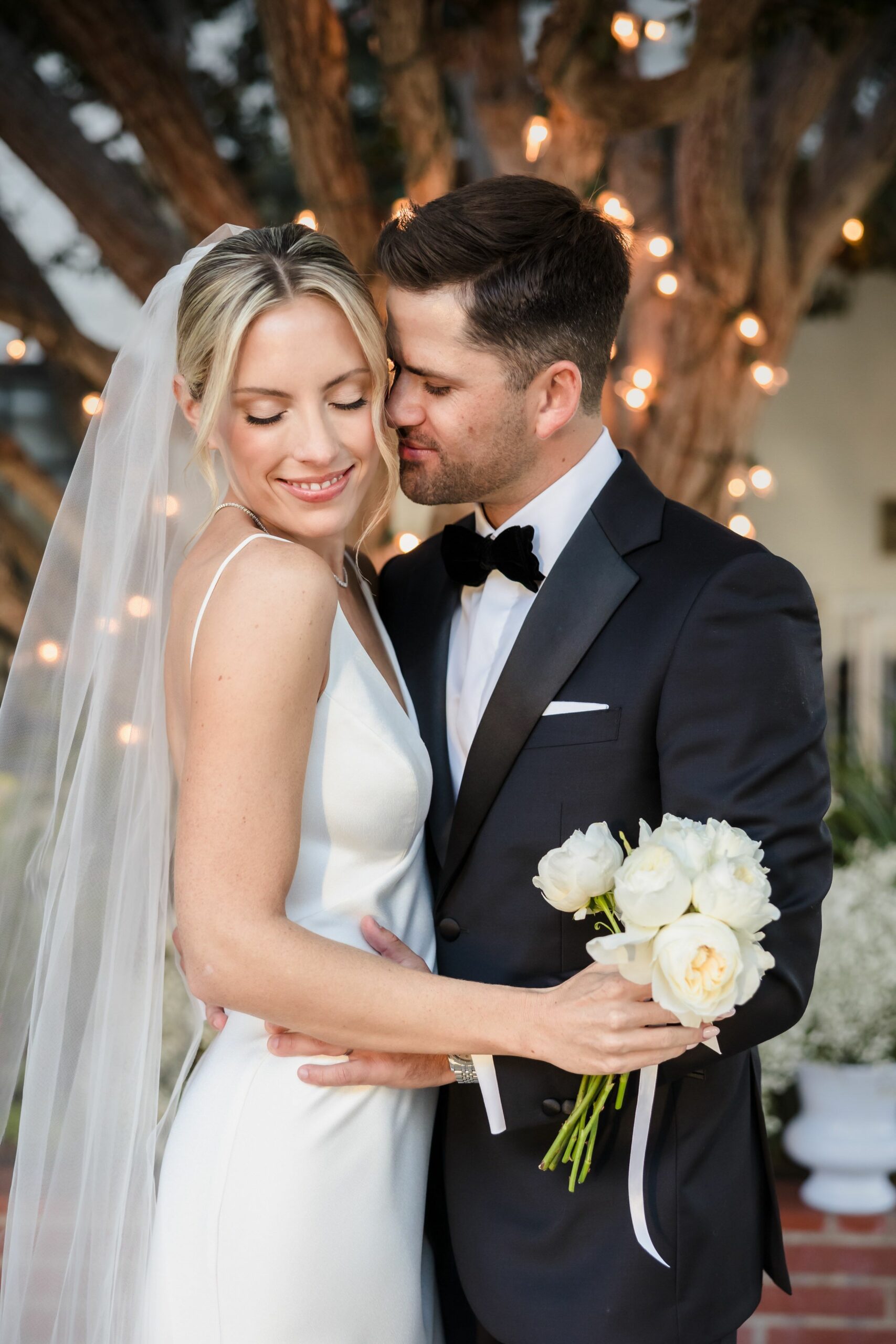 Timeless love and effortless elegance! This stunning bride and groom embrace with pure joy, radiating style, romance, and sophistication. A picture-perfect moment capturing their unbreakable bond and wedding day bliss. #ElegantWedding #BrideAndGroom #TimelessLove #WeddingPhotography #StylishCouple #HappilyEverAfter